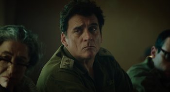 Movie still from “Golda” (2023), directed by Guy Nattiv – A person wearing a jacket; Close Up shot, Low angle