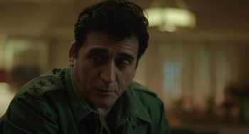 Movie still from “Golda” (2023), directed by Guy Nattiv – A person wearing a green shirt; Close Up shot, Over the shoulder angle