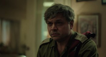 Movie still from “Golda” (2023), directed by Guy Nattiv – A person wearing a military uniform; Close Up shot, Over the shoulder angle