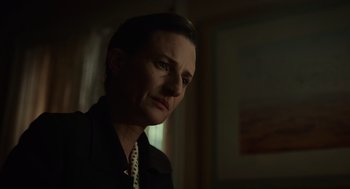 Movie still from “Golda” (2023), directed by Guy Nattiv – A woman in a black shirt is looking to her left; Close Up shot, Low angle