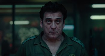 Movie still from “Golda” (2023), directed by Guy Nattiv – A person wearing a uniform; Close Up shot, Low angle