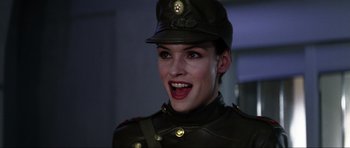 Movie still from “GoldenEye” (1995), directed by Martin Campbell – A person wearing a uniform; Close Up shot, Low angle