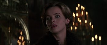 Movie still from “GoldenEye” (1995), directed by Martin Campbell – A person with short hair; Close Up shot, Over the shoulder angle