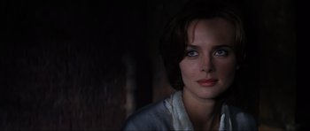 Movie still from “GoldenEye” (1995), directed by Martin Campbell – A person wearing a white shirt; Close Up shot, Over the shoulder angle