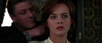 Movie still from “GoldenEye” (1995), directed by Martin Campbell – A person with green eyes; Close Up shot, Over the shoulder angle