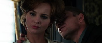 Movie still from “GoldenEye” (1995), directed by Martin Campbell – A man and a woman looking at each other; Close Up shot, Over the shoulder angle