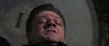 Movie still from “GoldenEye” (1995), directed by Martin Campbell – A person with a head injury; Close Up shot, Low angle