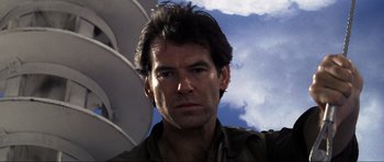 Movie still from “GoldenEye” (1995), directed by Martin Campbell – A person wearing a shirt; Close Up shot, Low angle