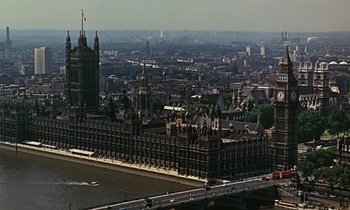 Movie still from “Goldfinger” (1964), directed by Guy Hamilton – An aerial view of a large city with a bridge; Extreme Wide shot, High angle