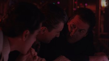 Movie still from “Goodfellas” (1990), directed by Martin Scorsese – A group of men sitting around a table; Close Up shot, Over the shoulder angle