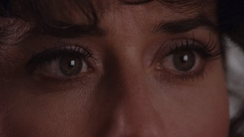 Movie still from “Goodfellas” (1990), directed by Martin Scorsese – A woman's eyes with green eyes; Extreme Close Up shot, Overhead angle