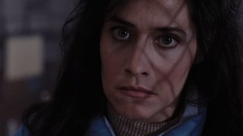 Movie still from “Goodfellas” (1990), directed by Martin Scorsese – A person with long black hair; Close Up shot, Over the shoulder angle