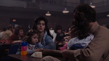 Movie still from “Goodfellas” (1990), directed by Martin Scorsese – A group of people sitting around a table; Medium shot, Over the shoulder angle