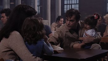 Movie still from “Goodfellas” (1990), directed by Martin Scorsese – A group of people sitting around a table; Medium shot, Over the shoulder angle