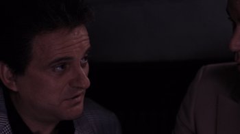 Movie still from “Goodfellas” (1990), directed by Martin Scorsese – A person looking at a camera; Close Up shot, Over the shoulder angle