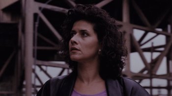 Movie still from “Goodfellas” (1990), directed by Martin Scorsese – A person with curly hair wearing a purple shirt; Close Up shot, Low angle
