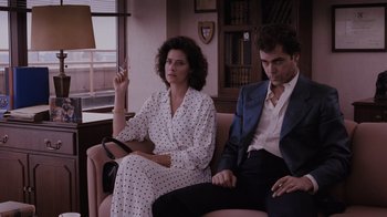 Movie still from “Goodfellas” (1990), directed by Martin Scorsese – A man and a woman sitting on a couch; Medium shot, Low angle