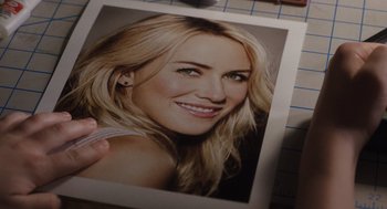 Movie still from “Goodnight Mommy” (2022), directed by Matt Sobel – A picture of a woman with blonde hair; Extreme Close Up shot, Overhead angle