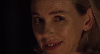 Movie still from “Goodnight Mommy” (2022), directed by Matt Sobel – A woman's face in the dark; Close Up shot, Over the shoulder angle