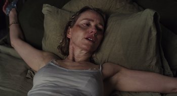 Movie still from “Goodnight Mommy” (2022), directed by Matt Sobel – A person laying on a bed; Close Up shot, Overhead angle