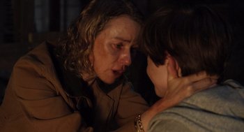 Movie still from “Goodnight Mommy” (2022), directed by Matt Sobel – A woman and a boy are looking at one another; Close Up shot, Over the shoulder angle