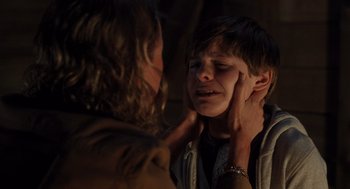 Movie still from “Goodnight Mommy” (2022), directed by Matt Sobel – A young boy is crying in front of a mirror; Close Up shot, Over the shoulder angle