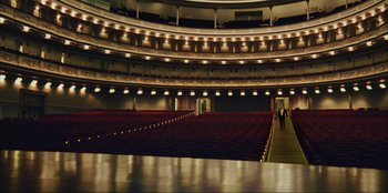 Movie still from “Green Book” (2018), directed by Peter Farrelly – A person is standing in an empty auditorium; Extreme Wide shot, High angle