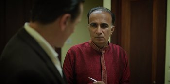 Movie still from “Green Book” (2018), directed by Peter Farrelly – A man in a red shirt looking at himself in the mirror; Close Up shot, Over the shoulder angle