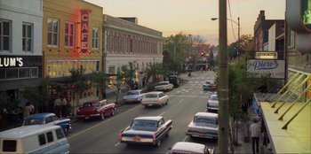 Movie still from “Green Book” (2018), directed by Peter Farrelly – A street with many cars driving down the road; Extreme Wide shot, High angle