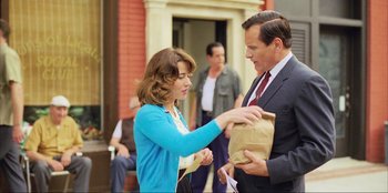 Movie still from “Green Book” (2018), directed by Peter Farrelly – A man and a woman are handing a bag to each other; Medium shot, Over the shoulder angle