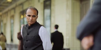 Movie still from “Green Book” (2018), directed by Peter Farrelly – A man in a black vest and a white shirt; Close Up shot, Low angle