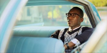 Movie still from “Green Book” (2018), directed by Peter Farrelly – A man sitting in the back seat of a car; Close Up shot, Low angle
