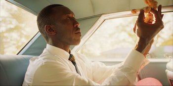 Movie still from “Green Book” (2018), directed by Peter Farrelly – A man sitting in the driver's seat of a car; Close Up shot, Low angle