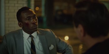 Movie still from “Green Book” (2018), directed by Peter Farrelly – A man in a suit and tie sitting in front of another man in a suit and tie; Close Up shot, Over the shoulder angle