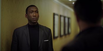 Movie still from “Green Book” (2018), directed by Peter Farrelly – A man in a suit looking into a mirror; Close Up shot, Over the shoulder angle