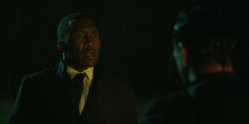 Movie still from “Green Book” (2018), directed by Peter Farrelly – A man wearing a suit and tie talking to another man wearing a suit and tie; Close Up shot, Over the shoulder angle