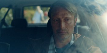 Movie still from “Another Round” (2020), directed by Thomas Vinterberg – A person sitting in a car; Close Up shot, Over the shoulder angle