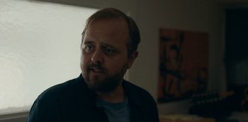 Movie still from “Another Round” (2020), directed by Thomas Vinterberg – A person with a beard; Close Up shot, Over the shoulder angle