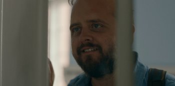 Movie still from “Another Round” (2020), directed by Thomas Vinterberg – A person with a beard; Close Up shot, Low angle