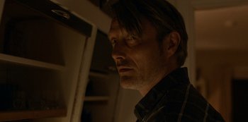 Movie still from “Another Round” (2020), directed by Thomas Vinterberg – A person wearing a plaid shirt; Close Up shot, Over the shoulder angle