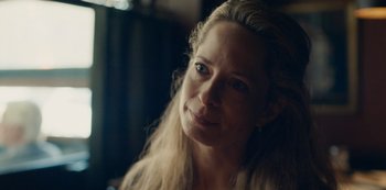 Movie still from “Another Round” (2020), directed by Thomas Vinterberg – A person with long blonde hair; Close Up shot, Over the shoulder angle