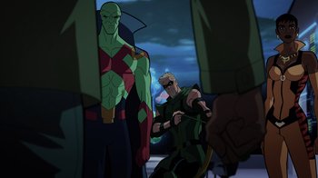 Movie still from “Green Lantern: Beware My Power” (2022), directed by Jeff Wamester – A man in a green outfit is holding a bow and arrow; Wide shot, Over the shoulder angle