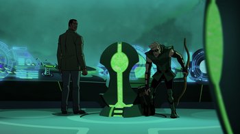 Movie still from “Green Lantern: Beware My Power” (2022), directed by Jeff Wamester – Two men standing in front of a green arrow; Wide shot, High angle