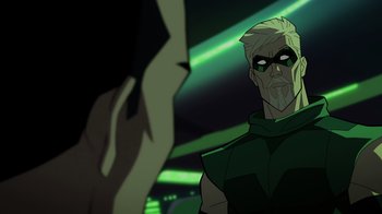 Movie still from “Green Lantern: Beware My Power” (2022), directed by Jeff Wamester – A man in a green outfit looking at another man in a black suit; Close Up shot, Over the shoulder angle