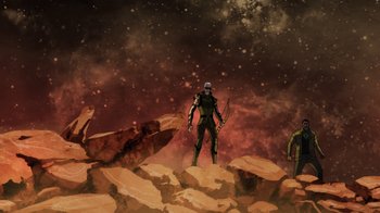 Movie still from “Green Lantern: Beware My Power” (2022), directed by Jeff Wamester – A group of people standing on top of a rock formation; Extreme Wide shot, Low angle