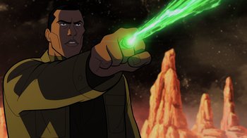 Movie still from “Green Lantern: Beware My Power” (2022), directed by Jeff Wamester – An image of a man holding a green object in his hand; Medium shot, Over the shoulder angle