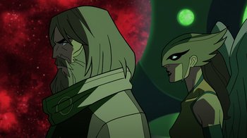 Movie still from “Green Lantern: Beware My Power” (2022), directed by Jeff Wamester – A man and a woman are standing next to each other in front of a red background; Close Up shot, Low angle