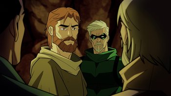 Movie still from “Green Lantern: Beware My Power” (2022), directed by Jeff Wamester – A group of men standing next to each other in a cave; Medium shot, Over the shoulder angle