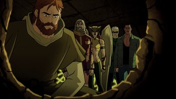 Movie still from “Green Lantern: Beware My Power” (2022), directed by Jeff Wamester – A group of people standing next to each other in a cave; Medium shot, High angle