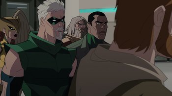 Movie still from “Green Lantern: Beware My Power” (2022), directed by Jeff Wamester – A group of men standing next to each other in a room; Medium shot, Over the shoulder angle